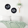 Coastal style Bedroom setting. Two blue and white Porthole paintings of Australian wildflowers on circular timber panels.